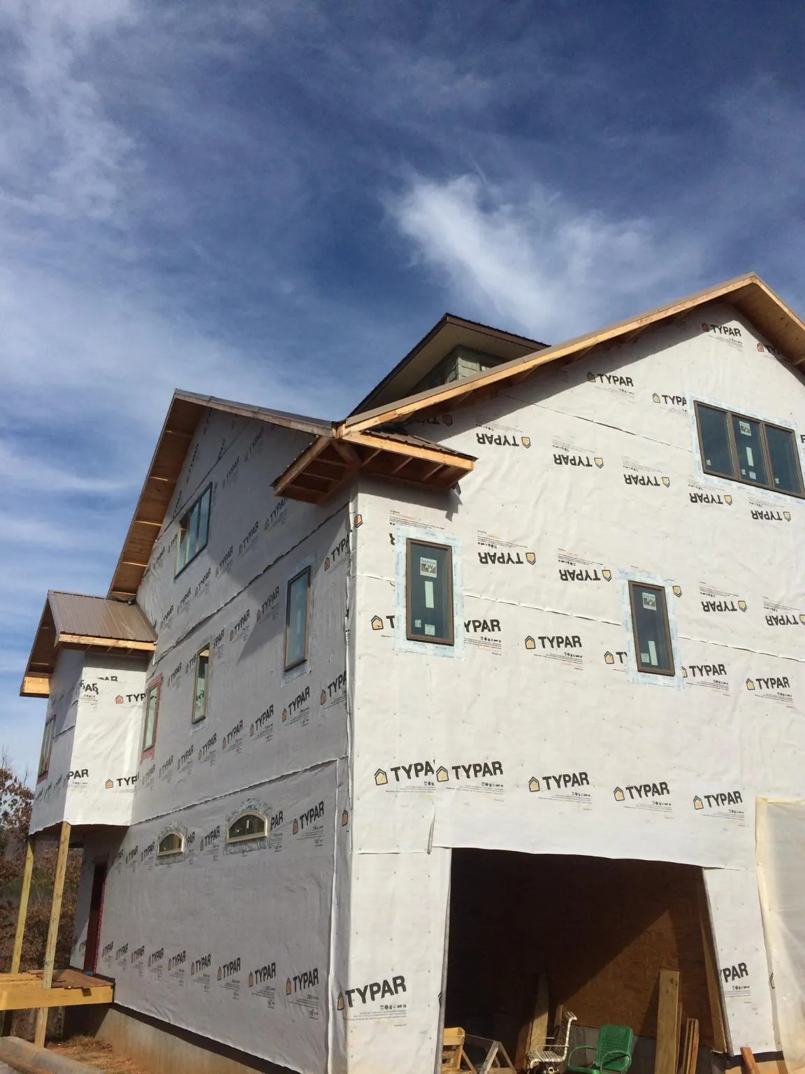 Stick built house wrapped in Typar with new roof framing and dormers in Sawyer